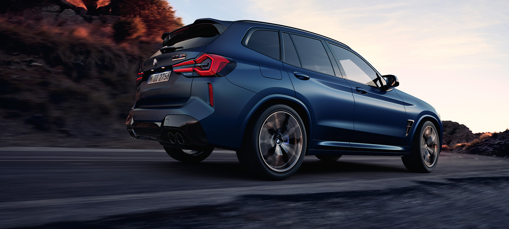 BMW X3 M Competition F97 LCI Facelift 2021 Frozen Marina Bay Blue metallic driving three-quarter rear view low angle shot