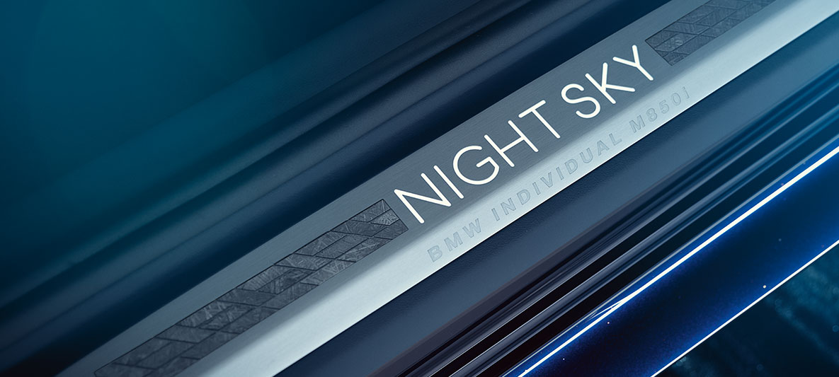 The BMW Individual NIGHT SKY door sill panel in mosaic design close up 